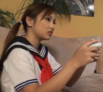 1boy 1girl animated animated_gif controller lowres photo_(medium) sailor school_uniform