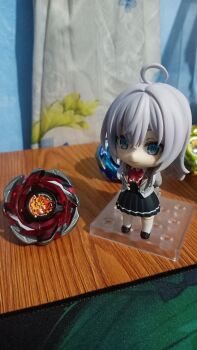 1girl absurdres alisa_mikhailovna_kujou beyblade beyblade_(object) beyblade_x dranbrave_s6-60v figure grey_hair hellsreaper_t4-70k highres long_hair nendoroid school_uniform smile tokidoki_bosotto_roshia-go_de_dereru_tonari_no_alya-san wizardarc_r4-55lo