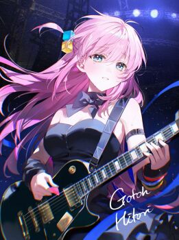 1girl absurdres black_bow black_bowtie black_choker black_dress blue_eyes blush bocchi_the_rock! bow bowtie breasts choker cleavage commentary_request cube_hair_ornament dress gotoh_hitori guitar hair_ornament highres holding holding_plectrum instrument large_breasts long_hair looking_at_viewer music one_side_up pink_hair playing_guitar playing_instrument plectrum pong_(pong_o0) smile solo stage stage_lights
