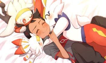 1boy bed_sheet blush brown_hair chitozen_(pri_zen) cinderace closed_eyes closed_mouth commentary_request dark-skinned_male dark_skin evolutionary_line eyelashes from_above gen_8_pokemon goh_(pokemon) hair_ornament hug lying male_focus nintendo on_back pants pokemon pokemon_(anime) pokemon_(creature) pokemon_journeys raboot scorbunny short_hair side_slit smile