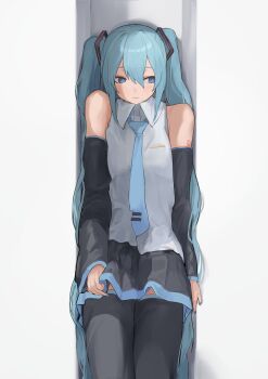 1girl against_wall bare_shoulders black_boots black_skirt blue_eyes blue_hair blue_necktie boots detached_sleeves grey_shirt hair_between_eyes hatsune_miku highres long_hair looking_to_the_side necktie number_tattoo pocche-ex shirt shoulder_tattoo skirt sleeveless sleeveless_shirt solo standing tattoo thigh_boots twintails vocaloid