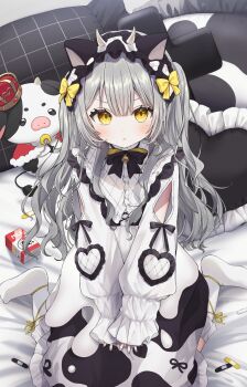 1girl :t absurdres animal_ears animal_print bandaid bell black_bow black_bowtie black_dress blush bow bowtie character_request closed_mouth clothing_cutout commentary copyright_request cow_ears cow_horns cow_print dot_nose dress drink_carton fake_animal_ears fake_horns frilled_shirt_collar frills gomamiso_(gomagoma_bba) grey_hair grey_nails hair_between_eyes hair_bow hairband heart highres horns indoors lolita_hairband long_hair long_sleeves looking_at_viewer milk_carton mole mole_under_eye neck_bell no_shoes on_bed own_hands_together pillow pout ribbon sitting socks solo stuffed_animal stuffed_cow stuffed_toy two-tone_dress v_arms wariza white_dress white_socks yellow_bow yellow_eyes yellow_ribbon
