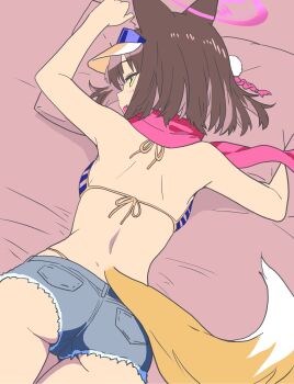 animal_ears ass backboob bare_shoulders bed bed_sheet bikini blue_archive blue_bikini blush breasts brown_hair commentary fang fox_ears fox_tail from_behind halo highres izuna_(blue_archive) izuna_(swimsuit)_(blue_archive) looking_at_viewer lying medium_hair ochazuke_(artist) on_stomach pillow pink_halo pink_scarf scarf short_shorts shorts small_breasts smile striped_bikini striped_clothes swimsuit tail tassel visor_cap