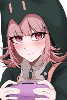 1girl bb_14ha blush brown_hair collared_shirt danganronpa_(series) danganronpa_2:_goodbye_despair flipped_hair green_jacket hair_ornament handheld_game_console highres holding holding_handheld_game_console hood hood_up jacket long_sleeves looking_at_viewer medium_hair nanami_chiaki neck_ribbon open_clothes open_jacket pink_eyes pink_ribbon ribbon shirt smile solo white_shirt