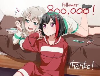 2girls aoba_moca artist_request bang_dream! bed black_hair collarbone mp3_player earphones earphones_removed milestone_celebration green_eyes grey_hair hood hooded_sweater lying mitake_ran multicolored_hair multiple_girls official_art on_stomach open_mouth red_eyes red_hair sharing sitting socks sweater two-tone_hair