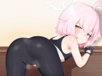 1girl absurdres ahoge ass black_gloves blue_archive blue_eyes gloves goki_buri halo heterochromia highres hoshino_(blue_archive) loli looking_at_viewer pink_hair short_hair solo sports_bra white_halo yellow_eyes