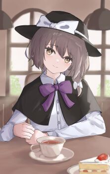 1girl black_capelet black_hat bow bowtie brown_eyes brown_hair cake cake_slice capelet closed_mouth collared_shirt commentary cup food hair_bow hat hat_bow highres indoors long_hair long_sleeves looking_at_viewer purple_bow purple_bowtie saucer shirt sitting smile solo strawberry_shortcake tea teacup tentyuu_th touhou usami_renko white_bow white_shirt