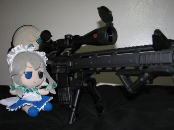 2girls aiming bipod blue_eyes bob_cut bow closed_mouth frilled_sleeves frills fumo_(doll) green_bow green_eyes grey_hair gun hair_bow izayoi_sakuya jitome konpaku_youmu maid maid_headdress maid_unfiorm multiple_girls photo_(medium) rifle scope short_hair sidelocks sitting sniper_rifle source_request teamwork touhou weapon