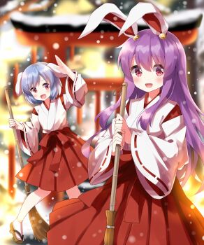 2girls alternate_costume animal_ears arm_up blue_hair blurry blurry_background blush bow breasts broom brown_sandals commentary_request detached_sleeves geta hair_between_eyes hand_up hands_up highres holding holding_broom japanese_clothes lantern long_hair long_sleeves looking_at_viewer looking_to_the_side medium_breasts miko multiple_girls open_mouth paper_lantern pink_eyes purple_hair rabbit_ears rabbit_girl red_bow red_eyes red_shirt red_skirt reisen_(touhou_bougetsushou) reisen_udongein_inaba ruu_(tksymkw) sandals shirt short_hair sidelocks skirt smile snow snowing socks standing tongue torii touhou vest white_socks white_vest wide_sleeves winter