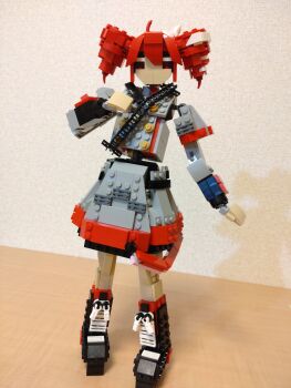 Rule 34 | 1girl, ahoge, black boots, boots, buttons, choroli (chorolin), double-breasted, drill hair, full body, grey jacket, grey skirt, hair between eyes, hair ribbon, hand up, highres, jacket, kasane teto, kasane teto (sv), lego (medium), long sleeves, looking at viewer, red eyes, red hair, ribbon, shoulder belt, skirt, solo, standing, synthesizer v, twin drills, unconventional media, utau, white ribbon