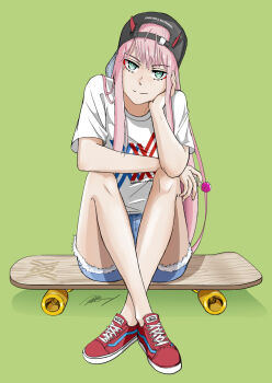 1girl albyee backwards_hat baseball_cap black_hat blue_shorts candy closed_mouth crossed_ankles darling_in_the_franxx denim denim_shorts elbow_rest eyeshadow food full_body green_background green_eyes hat highres holding holding_candy holding_food holding_lollipop horns horns_through_headwear lollipop long_hair looking_at_viewer makeup pink_hair red_eyeshadow red_horns red_shoes shirt shoes short_shorts short_sleeves shorts signature simple_background sitting skateboard smile solo t-shirt vans very_long_hair white_shirt zero_two_(darling_in_the_franxx)