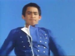 1boy animated armor black_eyes black_hair creature enemies energy fingerless_gloves full_armor gloves henshin jacket lowres metal_hero pants real_life shaider sound tagme toei_company transformation uchuu_keiji_shaider video white_pants