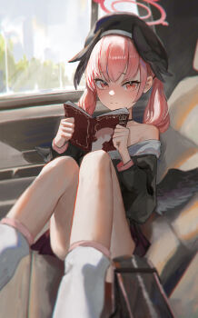 1girl absurdres bare_shoulders beret black_cardigan black_hat black_wings blue_archive blurry blush book car_interior cardigan closed_mouth depth_of_field embarrassed feathered_wings feet_out_of_frame halo hat head_wings highres holding holding_book knees_together_feet_apart koharu_(blue_archive) looking_at_viewer loose_socks low_twintails low_wings manga_(object) medium_hair neckerchief open_book pink_eyes pink_hair pink_halo pink_neckerchief pink_skirt reading ringed_eyes sailor_collar shippo_(pixiv_18567314) sitting skirt socks solo twintails white_sailor_collar wings