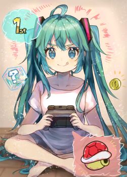 1girl ahoge aqua_eyes aqua_hair barefoot closed_mouth coin controller game_controller hatsune_miku highres holding holding_controller holding_game_controller long_hair mario_(series) mario_kart nintendo nintendo_switch_2 shell shirt sitting smile solo suiren_nei tongue tongue_out very_long_hair vocaloid white_shirt