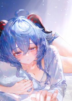 1girl ahoge blue_hair breasts cleavage commentary_request dolphin_shorts ganyu_(genshin_impact) genshin_impact goat_horns hair_between_eyes highres horns indoors long_sleeves looking_at_viewer lying parted_lips pillow purple_eyes shirt shorts solo utsuhostoria white_shirt