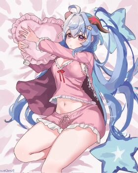 1girl blue_eyes blush breasts cleavage ganyu_(genshin_impact) genshin_impact goat_horns hair_ornament hairclip hashtag-only_commentary highres horns large_breasts long_hair looking_at_viewer navel on_bed pajamas pillow pink_pajamas purple_eyes solo woopsi9