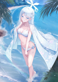 1girl beach bikini blue_archive blue_eyes blush braid breasts closed_mouth collarbone commentary day floating_clothes hair_ornament halo halterneck hand_on_own_cheek hand_on_own_face hand_on_own_thigh hand_up haori haori_on_shoulders highres japanese_clothes light_particles long_hair long_sleeves mountainous_horizon nagusa_(blue_archive) nagusa_(swimsuit)_(blue_archive) navel nezumi_(09261377) ocean official_alternate_costume outdoors palm_tree print_haori revision rock shallow_water single_braid small_breasts smile snowflake_hair_ornament snowflake_halo solo splashing standing stomach string_bikini swimsuit thighs tree very_long_hair wading water waves white_bikini white_hair white_halo white_haori