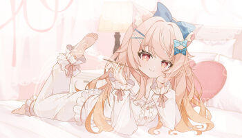 1girl absurdres animal_ear_fluff animal_ears barefoot bed bed_sheet blue_bow blue_bowtie bow bowtie breasts bright_pupils cat_ears center_frills commentary_request commission diana_rutile frills head_rest heart heart-shaped_pillow highres holding indie_virtual_youtuber indoors long_hair long_sleeves looking_at_viewer lying medium_breasts mimikaki on_stomach pajamas pillow pink_pajamas pink_ribbon red_eyes ribbon saekiya_sabou sidelocks skeb_commission smile the_pose virtual_youtuber watermark wavy_hair white_pupils