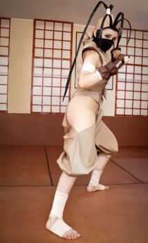 1girl absurdres black_hair capcom cosplay cosplay_photo female_focus fighting_stance half_mask highres ibuki_(street_fighter) ibuki_(street_fighter)_(cosplay) looking_at_viewer mask ninja photo_(medium) real_life solo street_fighter zettai_cos