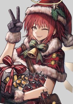 1girl ;d absurdres arknights bell black_gloves bow bowtie box brown_bag capelet cigaros commentary exusiai_(arknights) fur-trimmed_capelet fur-trimmed_gloves fur_trim gift gift_box gloves green_bow green_bowtie grey_background halo hand_up hat highres holding holding_box looking_at_viewer neck_bell one_eye_closed open_mouth originite_prime_(arknights) originium_(arknights) red_capelet red_hair red_hat santa_costume santa_hat simple_background smile solo symbol-only_commentary traditional_halo upper_body v yellow_eyes
