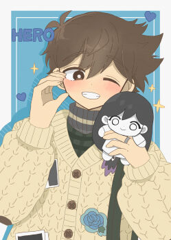 1boy absurdres alternate_eye_color antenna_hair blush bright_pupils brown_eyes brown_hair cardigan character_doll character_name commentary dark-skinned_male dark_skin doll double-parted_bangs grin hair_between_eyes hero_(birthday)_(omori) hero_(faraway)_(omori) hero_(omori) highres holding holding_stuffed_toy long_sleeves looking_at_viewer official_alternate_costume omori photo_(object) short_hair smile solo something_(omori) sparkle stuffed_animal stuffed_toy sweater teeth turtleneck turtleneck_sweater white_cardigan white_pupils yuuabara