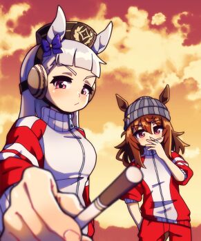 2girls animal_ears beanie blunt_bangs blush bow breasts brown_hair cigarette closed_mouth ear_bow ears_through_headwear gold_ship_(umamusume) grey_hair grey_hat hair_between_eyes hand_in_pocket hat highres holding holding_cigarette horse_ears horse_girl jacket kitnoko long_hair long_sleeves looking_at_viewer meme multiple_girls nakayama_festa_(umamusume) orange_sky pants photo-referenced pillbox_hat purple_bow purple_eyes red_jacket red_pants red_track_suit sky sleeves_rolled_up smoking tracen_training_uniform track_jacket track_pants track_suit umamusume