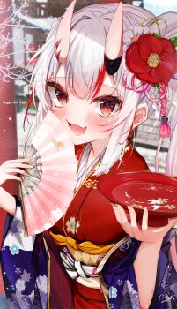 1girl 2026 :3 absurdres alcohol commentary_request cup dot_nose fang hair_between_eyes hand_fan highres holding hololive horn_ornament horns japanese_clothes kimono light_blush long_hair long_sleeves looking_at_viewer miaruri multicolored_hair nail_polish nakiri_ayame new_year oni open_mouth outdoors paper_fan red_eyes red_hair red_kimono sakazuki sake skin-covered_horns torii virtual_youtuber white_hair wide_sleeves winter