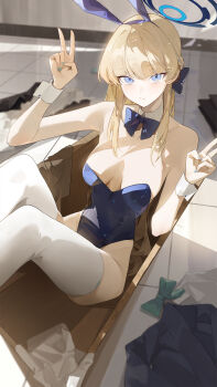 1girl animal_ears bare_shoulders blonde_hair blue_archive blue_eyes blue_leotard breasts cleavage detached_collar fake_animal_ears halo highleg highleg_leotard highres kji_(rozo) leotard long_hair looking_at_viewer medium_breasts playboy_bunny rabbit_ears solo thighhighs thighs toki_(blue_archive) toki_(bunny)_(blue_archive) white_thighhighs wrist_cuffs