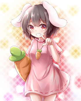 1girl absurdres animal_ears blush breasts brown_hair carrot_necklace chinese_commentary commentary cowboy_shot dress feng_ling_(fenglingwulukong) finger_to_mouth grin highres inaba_tewi jewelry looking_at_viewer lop_rabbit_ears necklace patterned_background pink_dress rabbit_ears rabbit_girl rabbit_tail red_eyes short_hair short_sleeves small_breasts smile solo stuffed_carrot tail touhou