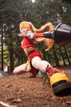 1girl absurdres ahoge armor blurry blurry_foreground brown_gloves closed_mouth commentary_request cosplay_photo cross-laced_shoes dirt eiyuu_densetsu estelle_bright fighting_stance fingerless_gloves floating_hair forest full_body gloves highres holding holding_staff holding_weapon kos_ho_sai long_hair multicolored_shoes nature orange_hair outdoors pauldrons photo_(medium) pink_lips red_eyes red_shoes red_skirt shoes shoulder_armor single_pauldron skirt smile sneakers solo sora_no_kiseki staff tree twintails two-tone_shoes weapon yellow_shoes