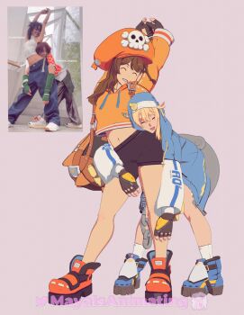 Rule 34 | 1boy, 1girl, androgyne symbol, bike shorts, blonde hair, boots, bridget (guilty gear), brown hair, cuffs, fingerless gloves, gloves, guilty gear, guilty gear strive, handcuffs, highres, hood, hood up, hooded jacket, hoodie, jacket, long hair, may (guilty gear), mayaisanimating, orange boots, orange headwear, orange hoodie, reference inset, skull and crossbones, smile, trap