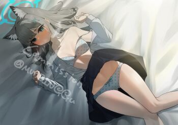 1girl absurdres animal_ear_fluff animal_ears aqua_eyes black_skirt blue_archive blush bow bow_bra bow_panties bra breasts bright_pupils closed_mouth clothes_lift collarbone commentary_request commission cross_hair_ornament feet_out_of_frame grey_bra grey_hair grey_panties grey_shirt hair_ornament hands_up highres knees_together_feet_apart long_hair long_sleeves lying medium_breasts moving_gun on_back on_bed open_clothes open_shirt panties parted_bangs pleated_skirt polka_dot polka_dot_bra polka_dot_panties school_uniform shiroko_(blue_archive) shirt sidelighting skirt skirt_lift solo strap_slip twitter_username underwear watermark white_pupils