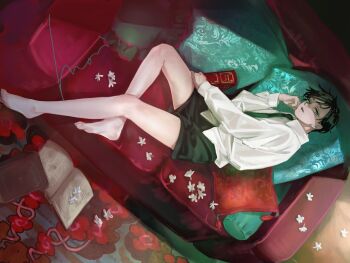 1boy barefoot black_hair black_necktie black_shorts book child couch cushion flower highres holding holding_book looking_at_viewer lying male_focus mori_hisato necktie on_couch open_book original rug shirt short_hair shorts white_flower white_shirt