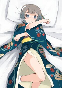 1girl absurdres alternate_costume blue_eyes blue_kimono feet_out_of_frame grey_hair highres japanese_clothes kantai_collection kazagumo_(kancolle) kimono lying pillow ponytail socks solo toplow white_socks wide_sleeves