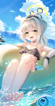 1girl :d absurdres alternate_costume barefoot bikini black_bikini black_choker black_scrunchie blue_archive blue_sky blurry blurry_background blush breasts choker cleavage cloud commentary cross_hair_ornament cumulonimbus_cloud day drone feet foot_out_of_frame frilled_bikini frills hair_intakes hair_ornament hair_scrunchie halo halterneck happy hare_(blue_archive) highres leehong_studio legs_together looking_at_viewer millennium_science_school_logo ocean open_mouth outdoors ponytail scrunchie sidelighting sidelocks sky small_breasts smile soaking_feet soles solo swim_ring swimsuit teeth toes water wet wrist_scrunchie yellow_eyes yellow_halo