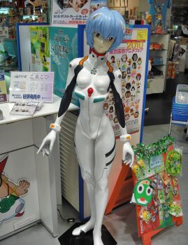 Rule 34 | 1girl, anpanman, anpanman (character), atom (tetsuwan atom), ayanami rei, ben 10, ben 10: alien force, ben tennyson, beyblade, bleach, blue hair, blue shirt, bodysuit, breasts, cartoon network, character print, doraemon, doraemon (character), dororo (keroro gunsou), edogawa conan, fairy tail, figure, giroro, hagane gingka, hair ornament, hershel layton, highres, interface headset (evangelion), keroro, keroro gunsou, kurosaki ichigo, kururu (keroro gunsou), looking at viewer, mecha pilot suit, meitantei conan, metal fight beyblade, namco, naruto (series), natsu dragneel, neon genesis evangelion, pac-man, pac-man (game), photo (medium), plugsuit (evangelion), poster (object), print shirt, professor layton, red eyes, shirt, short hair, small breasts, standing, tamagotchi, tamama, tetsuwan atom, unico (character), uzumaki naruto, white bodysuit