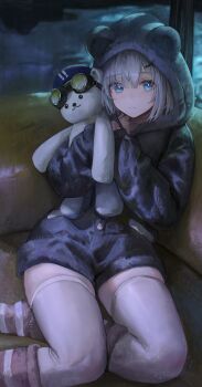 1girl absurdres animal_ears animal_hood arknights arknights:_endfield aurora_(arknights) bear_ears bear_hood blue_eyes closed_mouth commentary fake_animal_ears flippy_(cripine111) hair_ornament hairclip hands_up highres holding holding_stuffed_toy hood indoors leg_warmers long_sleeves looking_at_viewer short_hair sitting snowshine_(arknights) solo striped_leg_warmers stuffed_animal stuffed_toy teddy_bear thighhighs white_hair white_thighhighs
