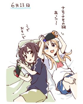 2girls :d barefoot blonde_hair blue_eyes blue_shirt blue_shorts blush_stickers brown_eyes brown_hair cropped_legs green_shorts handheld_game_console hashtag-only_commentary highres holding holding_handheld_game_console leg_up long_hair lying multiple_girls namori nintendo_switch on_back on_side open_mouth pillow print_shirt shirt short_hair short_sleeves shorts simple_background smile tomato_print translation_request v-shaped_eyebrows white_background white_shirt yuruyuri