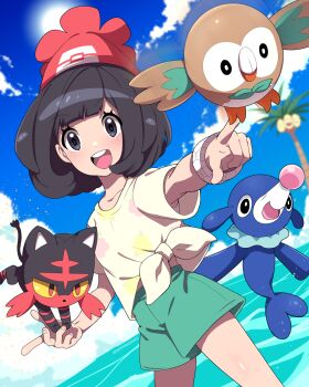 1girl :d alolan_exeggutor alolan_form beanie black_hair blurry blurry_background bracelet cloud commentary_request day gen_7_pokemon green_shorts happy hat highres jewelry litten nashirasauce nintendo open_mouth outdoors pointing pokemon pokemon_(creature) pokemon_sm popplio red_hat rowlet selene_(pokemon) shirt short_sleeves shorts sky smile starter_pokemon_trio t-shirt teeth tied_shirt upper_teeth_only water yellow_shirt