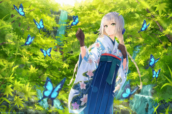 1girl blonde_hair blue_skirt blush braid brown_gloves bug butterfly commentary_request floral_print floral_print_kimono forest gloves green_eyes hair_ornament hakama hakama_skirt highres insect japanese_clothes kimono lens_flare light_rays long_hair na_kyo nature nijisanji parted_lips print_kimono scenery shioriha_ruri skirt solo standing sunbeam sunlight torii twin_braids virtual_youtuber water waterfall wide_sleeves